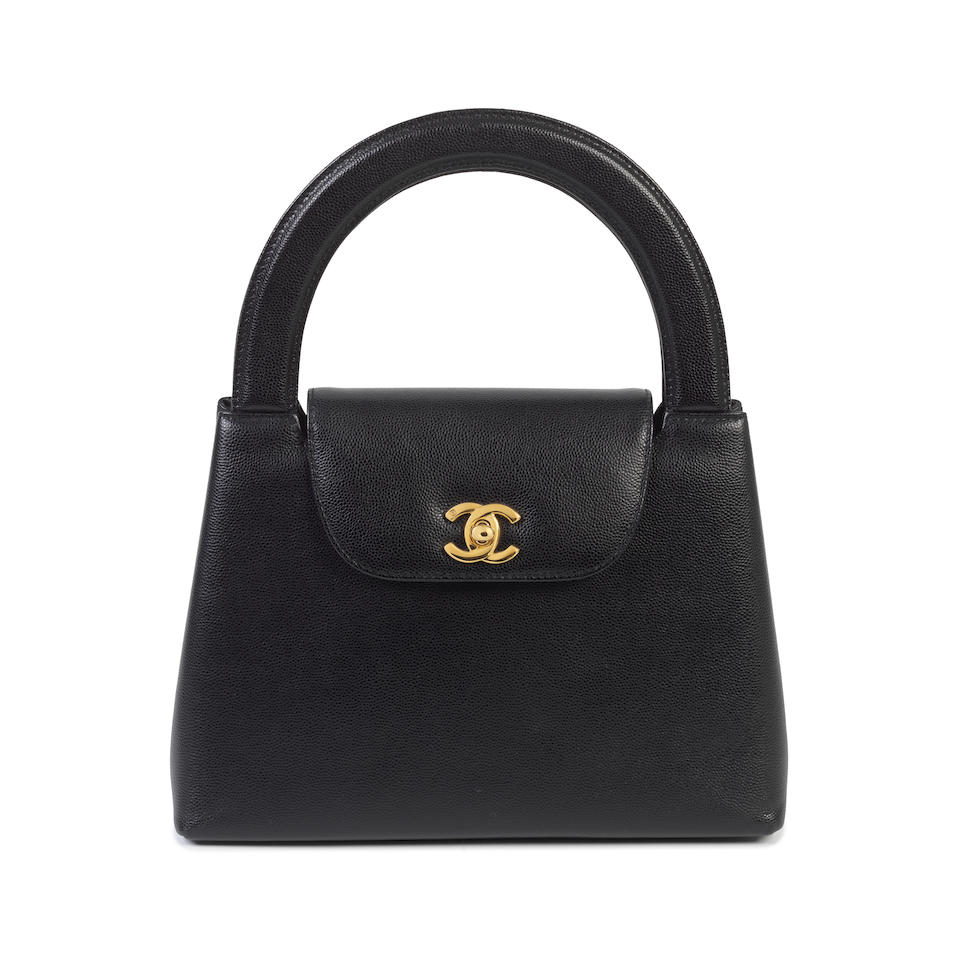Karl Lagerfeld for Chanel: a Black Caviar Leather Top Handle Kelly Bag 1997-99 (includes serial ...