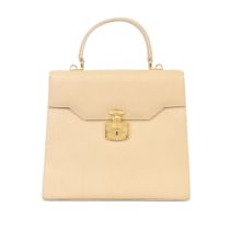 Gucci: a Beige Pigskin Lady Rock Handbag 1990s (includes gilt backed mirror)