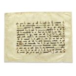 A large leaf from a dispersed Qur'an written in kufic script on vellum North Africa or Andalusia...