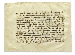 A large leaf from a dispersed Qur'an written in kufic script on vellum North Africa or Andalusia...