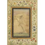 A Mughal prince standing in a landscape, holding a musket, sword and shield, formerly from an al...