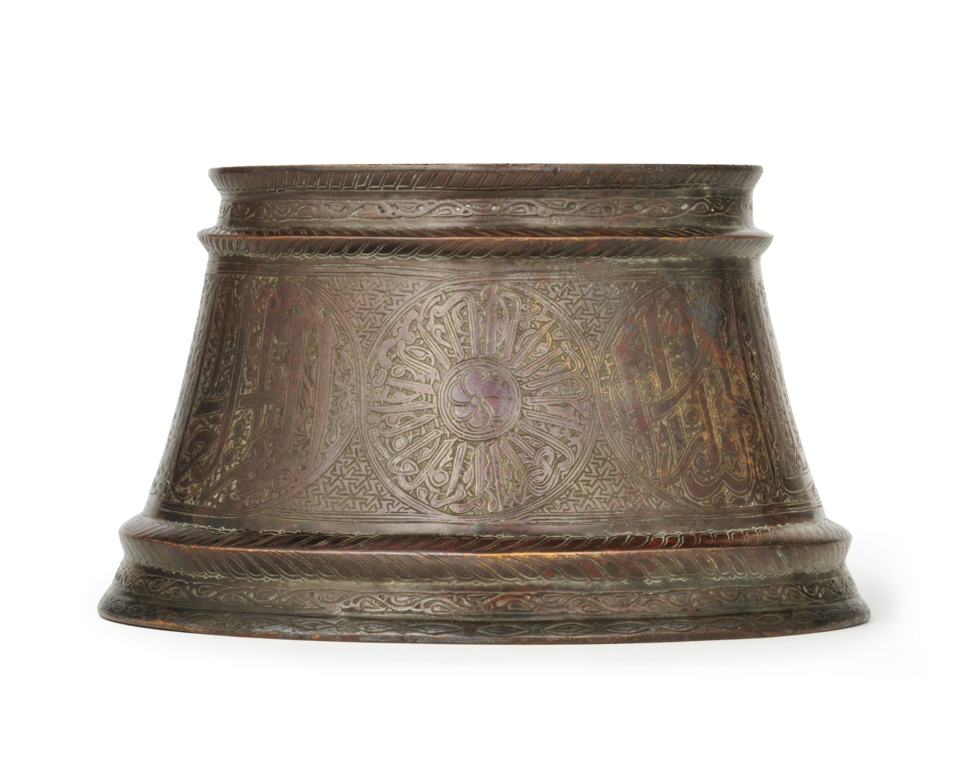 A Mamluk silver-inlaid bronze candlestick base Egypt or Syria, 14th Century