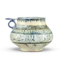 A Kashan underglaze-painted pottery jug Persia, 12th Century