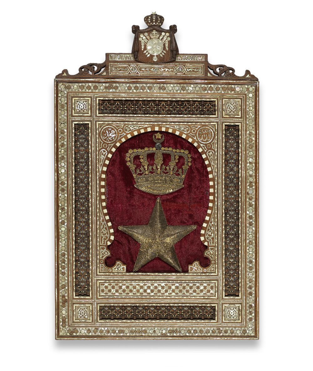 A mother-of-pearl and bone-inlaid wood panel with metal-thread embroidered velvet coat of arms p...