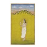 A Vallabhacharya priest standing in a landscape holding a lotus flower Kishangarh, circa 1820