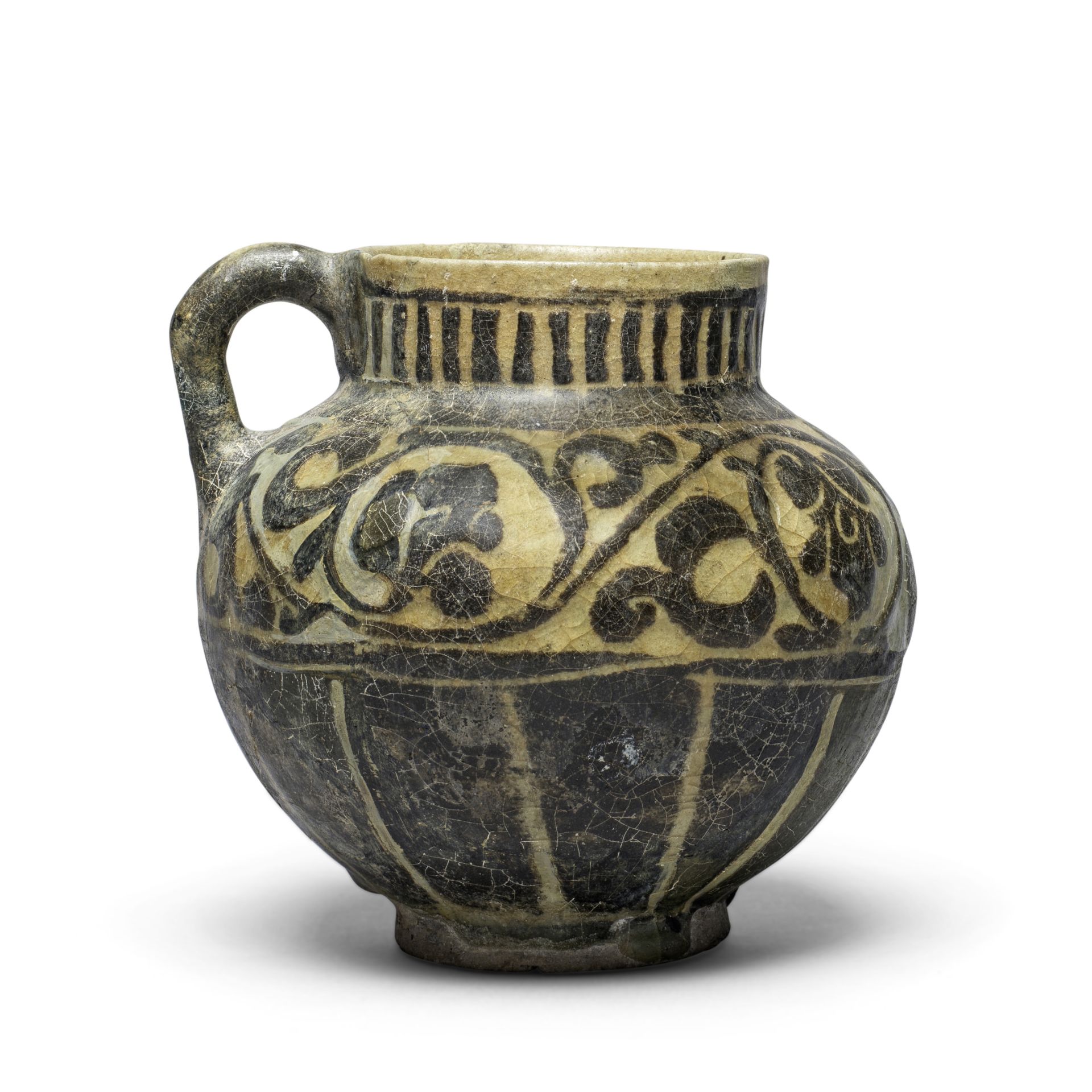 A Kashan silhouette ware pottery jug Persia, 12th/ 13th Century