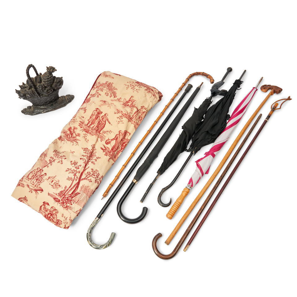 GROUP OF UMBRELLAS, CANES, TEXTILES, AND A DOORSTOP