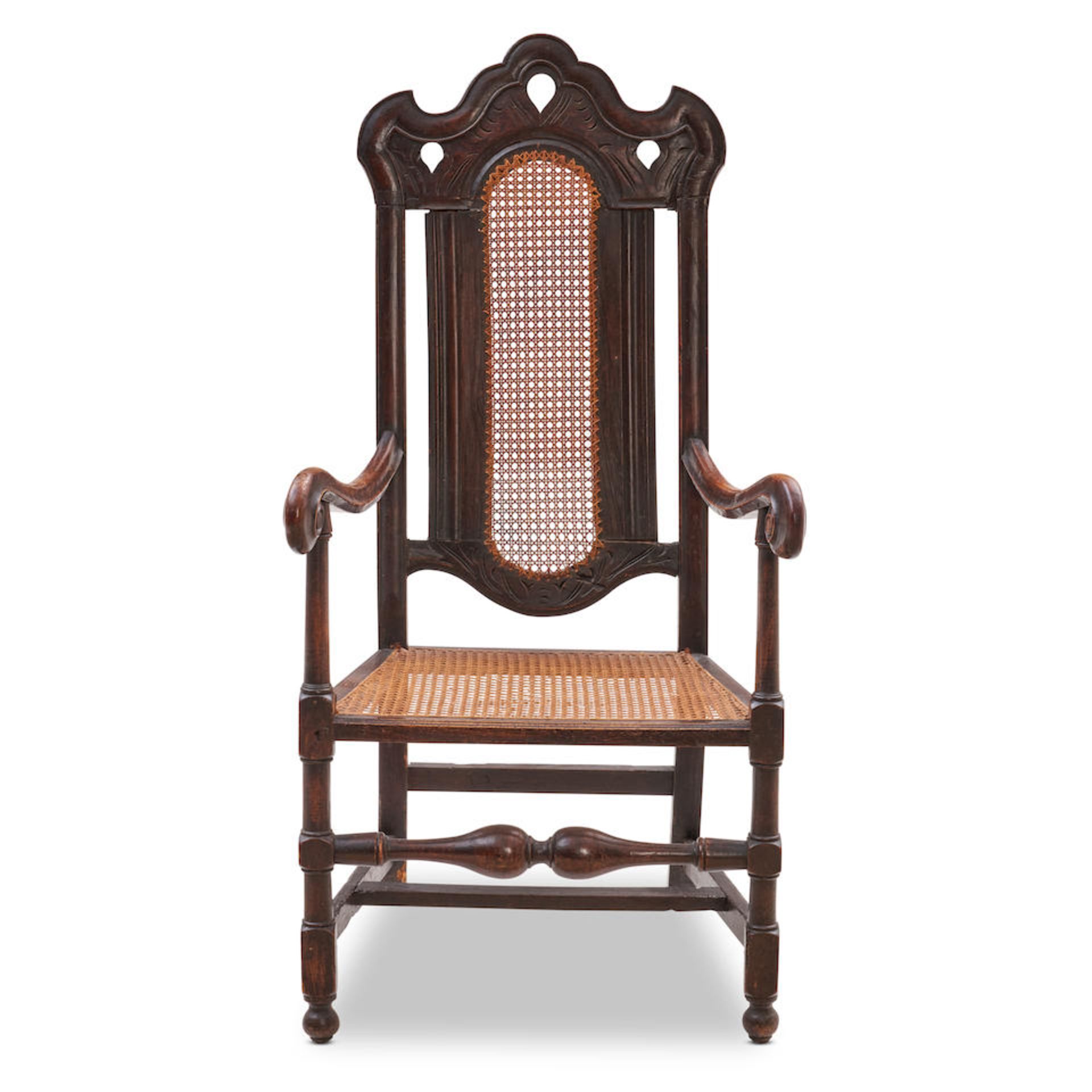 ENGLISH CARVED OAK AND CANED ARMCHAIR