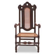 ENGLISH CARVED OAK AND CANED ARMCHAIR