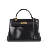 HERMES Paris, circa 1950/1960. Sac 'Kelly Retourn&#233;' en box noir.