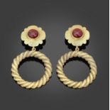 CHANEL, circa 1990. Paire de clips d'oreilles en m&#233;tal dor&#233; et pate de verre rouge. Di...