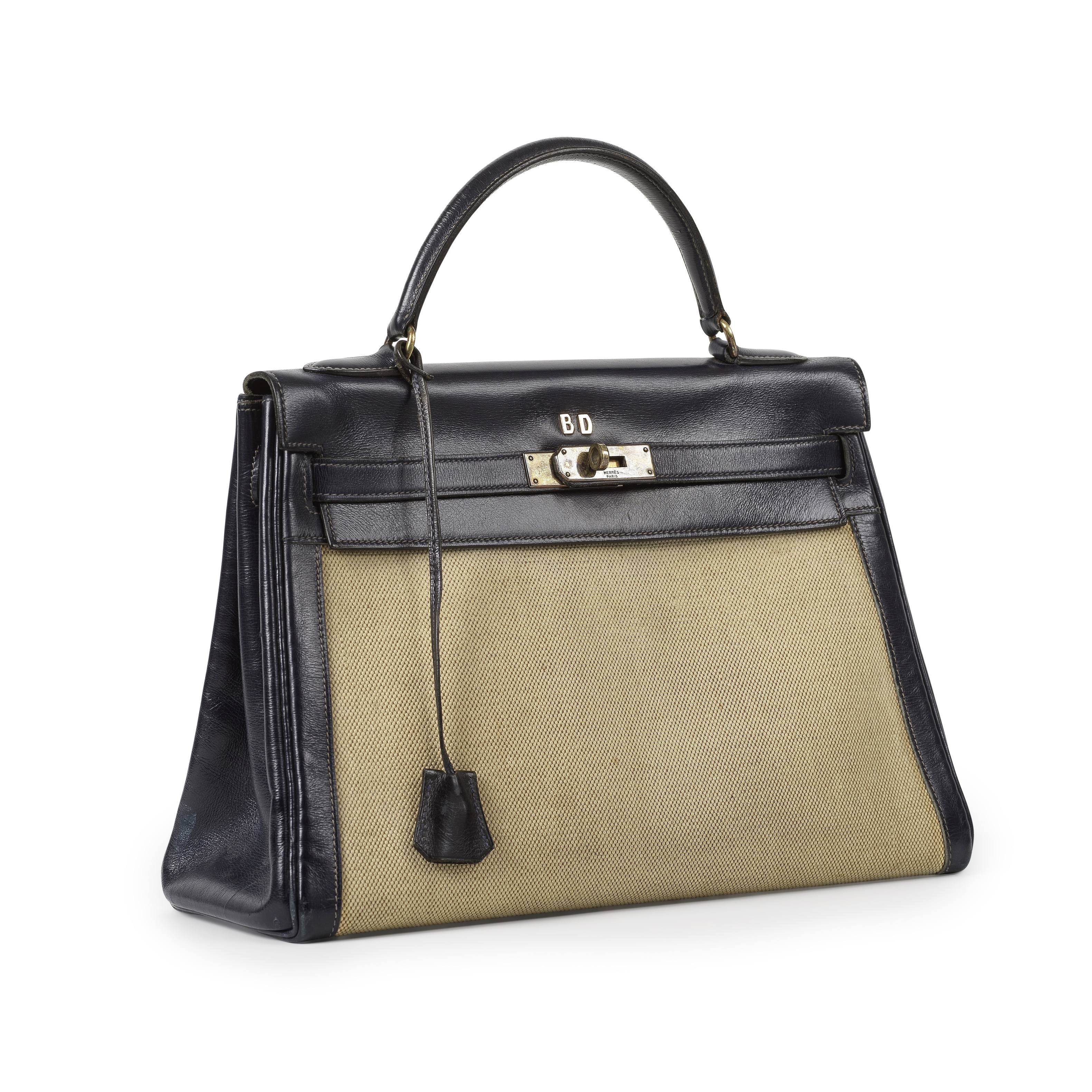 HERMES Paris, circa 1960. Sac 'Kelly Retourn&#233;' 32 cm en cuir box marine et toile H.