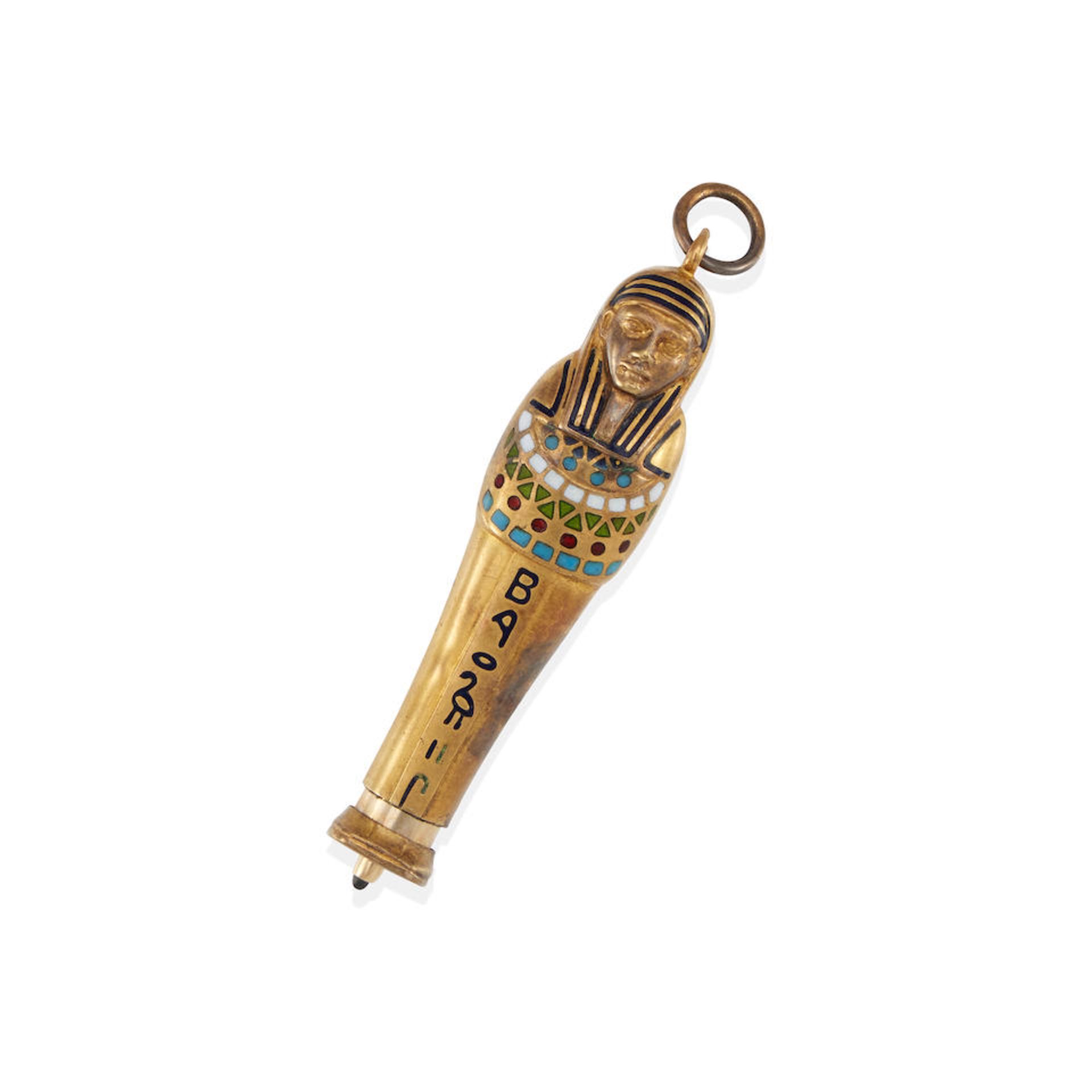 A GOLD AND ENAMEL EGYPTIAN CHARM/PENCIL