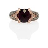 LEVIAN: A 14K ROSE GOLD, GARNET AND DIAMOND RING