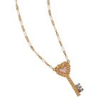 A 14K BICOLOR GOLD, CORAL, AND DIAMOND KEY PENDANT NECKLACE