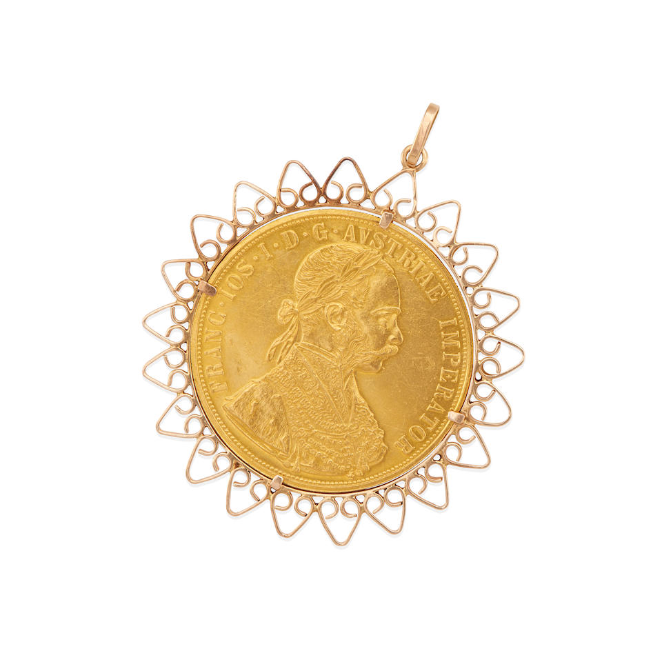 A 14K ROSE GOLD COIN FRAME PENDANT WITH AUSTRIAN COIN