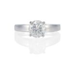 AN 18K WHITE GOLD AND DIAMOND SOLITAIRE RING
