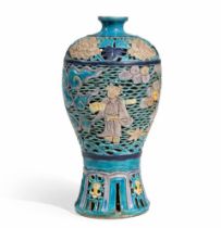 A RETICULATED FAHUA BALUSTER VASE, MEIPING Mid-Ming Dynasty