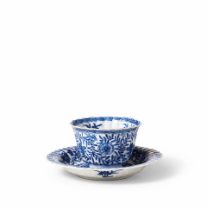 A BLUE AND WHITE FLUTED CUP AND SAUCER Kangxi