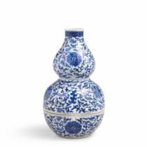 A BLUE AND WHITE DOUBLE-GOURD-FORM WINE POT AND WARMER Yongzheng six-character mark, Qing Dynast...
