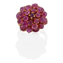 AN 18K GOLD RUBY CLUSTER RING