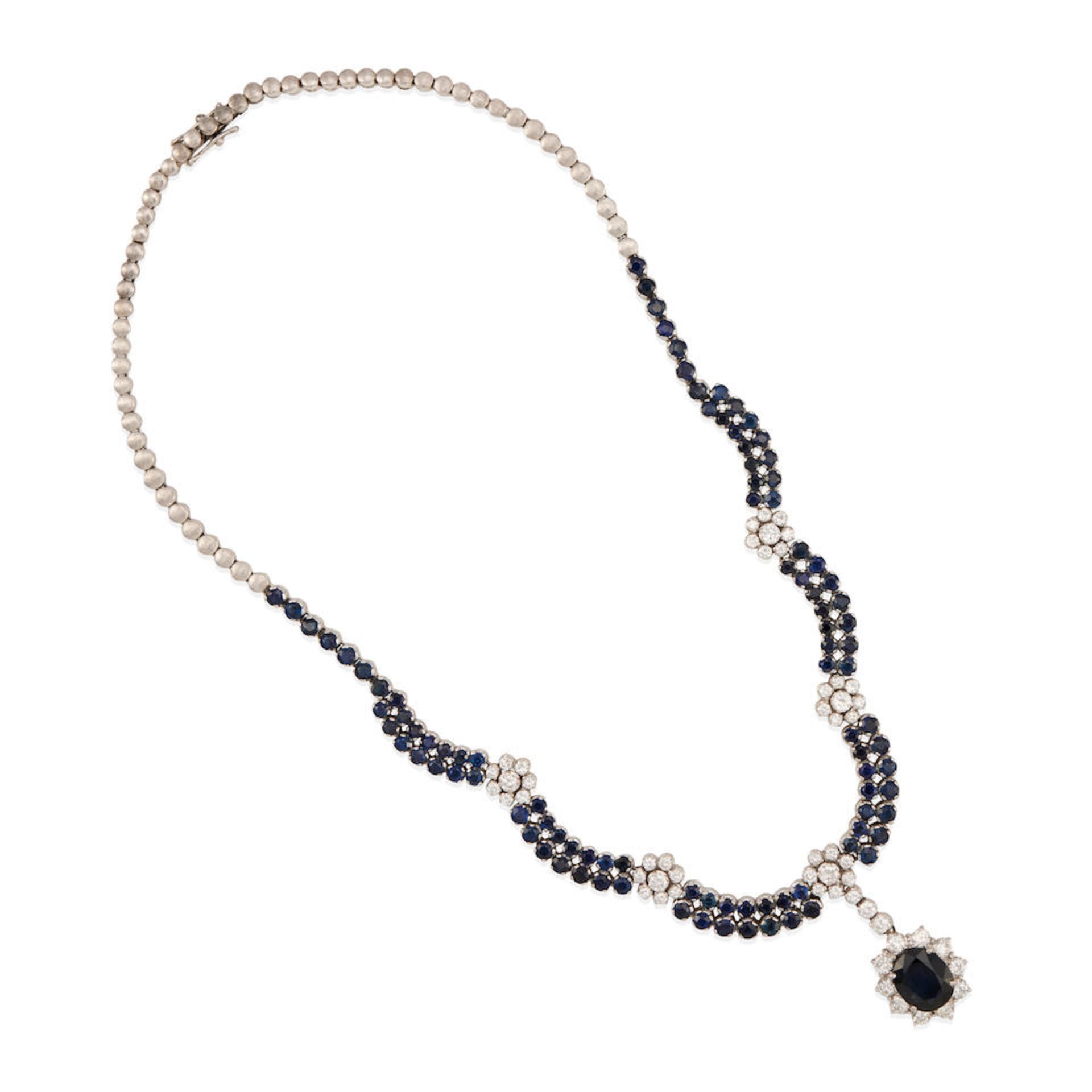 AN 18K WHITE GOLD, DIAMOND, AND SAPPHIRE PENDANT NECKLACE