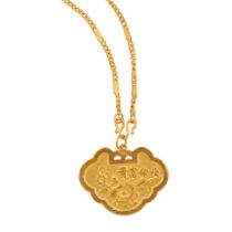 A 24K GOLD PENDANT WITH A 23K GOLD CHAIN