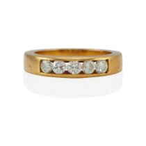 AN 18K GOLD AND DIAMOND RING