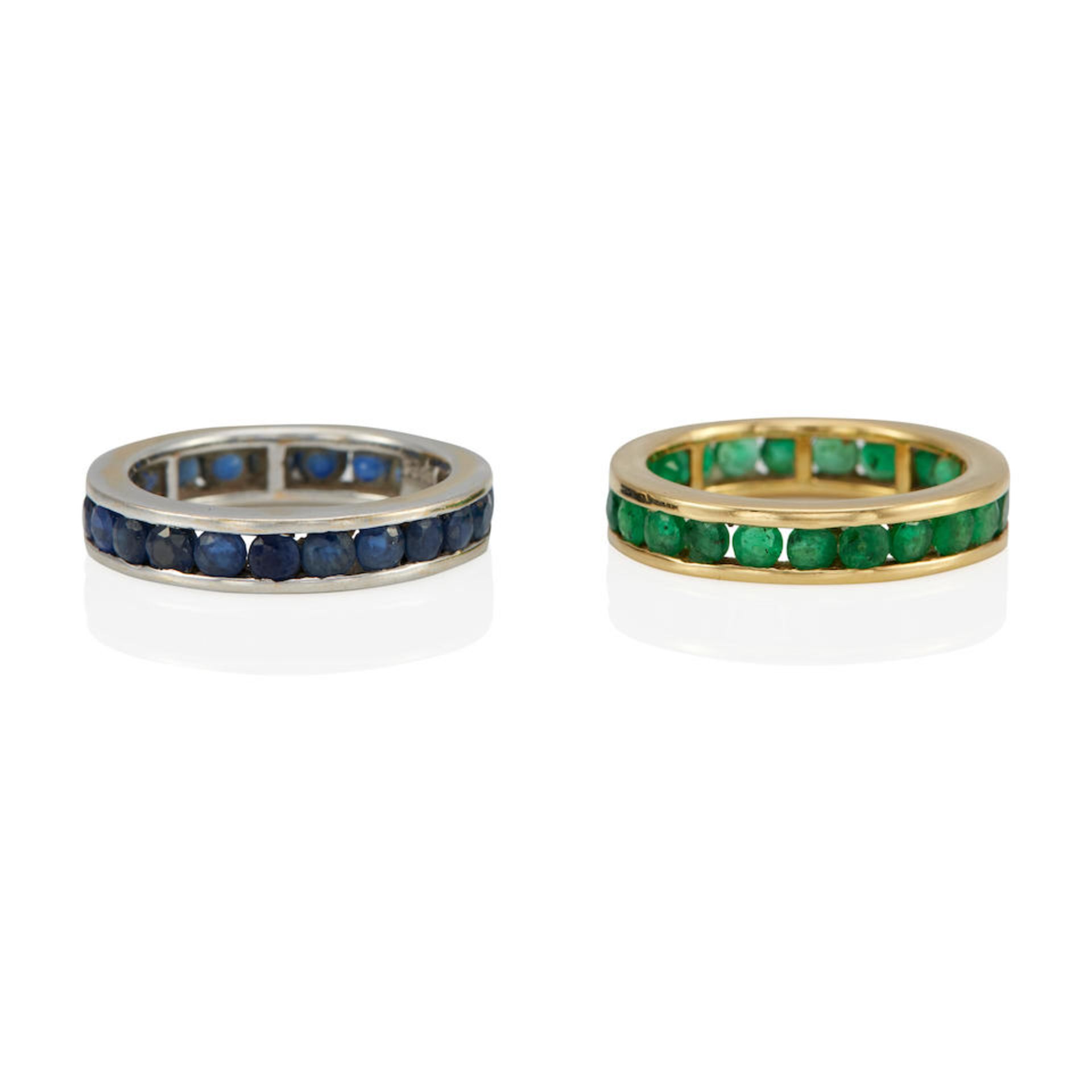 TWO 18K YELLOW AND WHITE GOLD EMERALD AND SAPPHIRE ETERNITY BAND RINGS