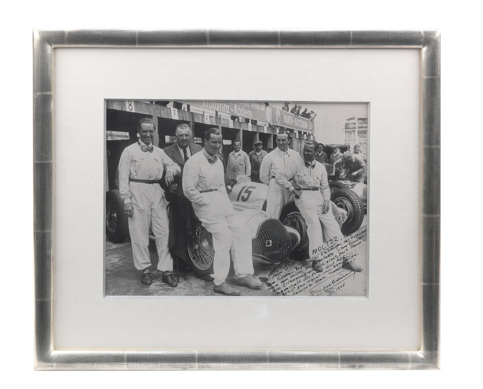 A photograph of the Mercedes Benz team at the German Grand Prix 1938, with signed dedication by ...