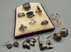 A Selection of silver rings and earrings; 925S Silver leaf brooch, four pairs of silver earrings and