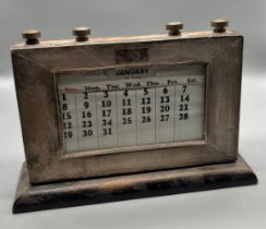 Birmingham silver framed desk calendar. Months of the year present. [14x21.5x6cm]