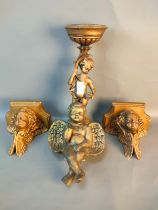 A selection of interior collectables; A pair of cherub wall sconces & cherub candle holder [36.5cm]