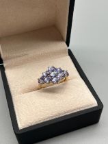 9ct yellow gold ring set with purple tourmaline stones. [Ring size P] [2.86Grams]