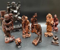 A collection of oriental root wood, carved figures [38.5cm]