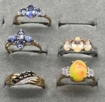 Four various 10ct gold rings and one 9ct gold ring- all with gem stones; 9ct gold ring with five