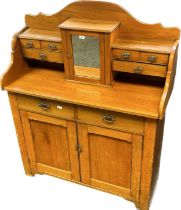 Antique dresser , the top with mirrored cupboard and flanked by an arrangement of drawers above