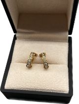 A Pair of 18ct yellow gold and diamond stone earrings. [3.58grams]