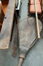 A Large antique blacksmiths bellows- with wooden stand and handle tool. [Approx 5 foot]