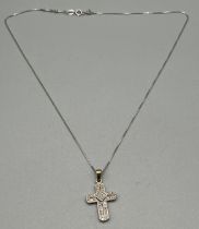 14ct white gold necklace together with a 9ct yellow gold and diamond cross pendant. [14ct- 1.