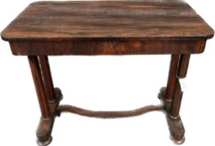 William IV Rosewood trestle table, the rounded rectangular top above a long frieze drawer, raised on