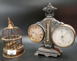 A Victorian cast iron barrel clock and barometer with foliate cast base and central column, the