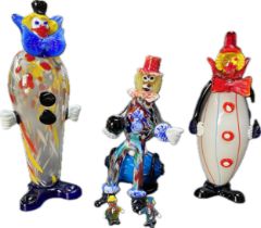 A collection of three large Murano glass clowns ; Clown sitting on barrel [41cm]
