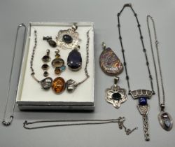 A Collection of silver 925 and gem stone pendants; Aztec style silver and lapis lazuli style pendant