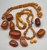 A Selection of amber bead necklaces and loose amber beads.