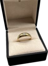 9ct yellow gold ring set with a 0.15ct round cut diamond. [Ring size V] [4.04Grams]