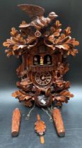 A Carved style Black forest quartz cuckoo clock with chamois & hunter by Trenkle Uhren [44cm]