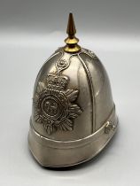 Vintage Police helmet table top lighter with brass spike finial.