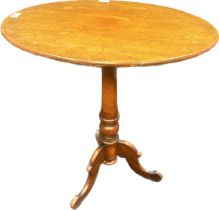 19th century mahogany side table, the oval surface raised on a tripod base [73x66x50cm]