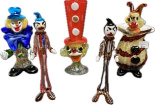 A collection of five Murano glass clowns figures; clown wearing large red hat & two naughty series
